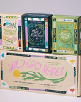 Wild Card Series Trilogy playing card boxes with botanical designs and educational information