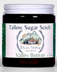 Jar of Tallow Sugar Scrub with a mountain and cabin design on the label