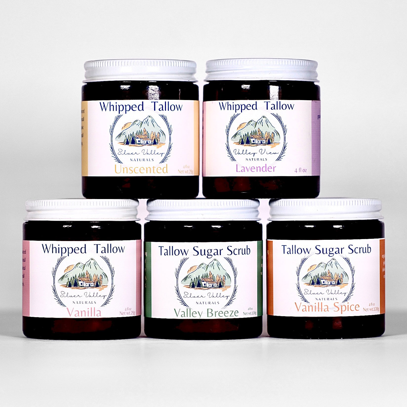 Collection of Whipped Tallow and Tallow Sugar Scrub containers with visible labels on a white background.