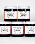 Collection of Whipped Tallow and Tallow Sugar Scrub containers with visible labels on a white background.