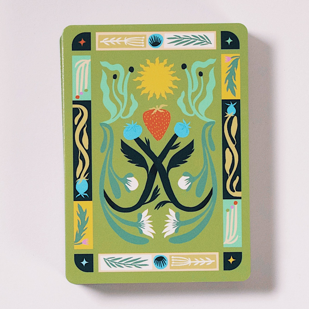 Illustrated playing card back with nature-themed design for Forest Feast deck