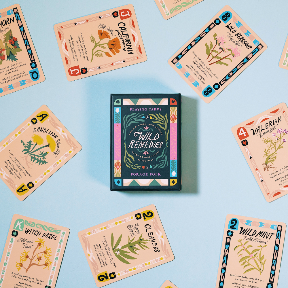 Card game Wild Remedies box surrounded by assorted illustrated 