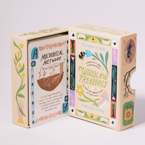 Woodland Treasures playing card boxes with botanical designs and forest educational information