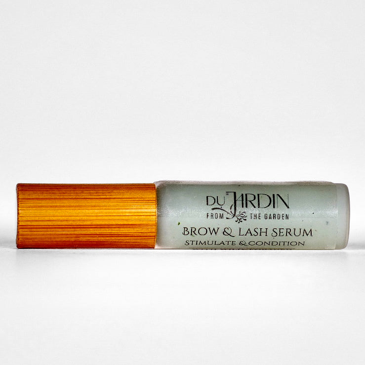 Du Jardin brow and lash serum with wooden applicator on a white background